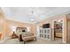 Serene main bedroom featuring a tray ceiling, a cozy sitting area, and a walk-in closet, creating a peaceful retreat at 1244 Saint Johns Ave, Matthews, NC 28104
