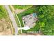 An aerial of a luxury estate featuring a private pool, manicured lawn and mature trees at 13106 Bien Ct, Huntersville, NC 28078