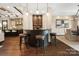 Modern bar area with sleek countertops, pendant lighting, and bar stools, perfect for entertaining at 13106 Bien Ct, Huntersville, NC 28078