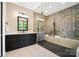 Elegant bathroom with a large vanity, glass-enclosed shower, and modern fixtures for a stylish retreat at 13106 Bien Ct, Huntersville, NC 28078