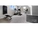 Spacious exercise room with wall-mounted equipment, treadmill, stationary bike and bright natural light at 13106 Bien Ct, Huntersville, NC 28078