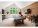 Entertainment area with a pool table, bar area, and rustic wood accent wall at 13106 Bien Ct, Huntersville, NC 28078