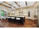 Spacious kitchen featuring a large island with bar seating, designer lighting, and wood beam accents at 13106 Bien Ct, Huntersville, NC 28078