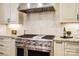 Gourmet kitchen with stainless steel appliances, custom cabinetry, and granite countertops at 13106 Bien Ct, Huntersville, NC 28078