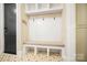 Convenient mudroom with seating, hooks, and storage, offering a practical and organized space at 13106 Bien Ct, Huntersville, NC 28078