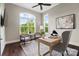 Bright office space featuring hardwood floors, large windows, and a stylish desk at 13106 Bien Ct, Huntersville, NC 28078