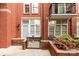 Charming brick patio with a small garden and a metal railing entrance, offering a cozy outdoor space at 1320 Fillmore Ave # 112, Charlotte, NC 28203