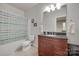 Traditional bathroom featuring a wooden vanity with a granite countertop and a shower-tub combo at 1342 Crown Ridge Dr # 38, Fort Mill, SC 29708