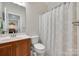 Clean bathroom with a classic vanity, decorative mirror, and a well-maintained shower area at 1342 Crown Ridge Dr # 38, Fort Mill, SC 29708