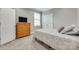 This bedroom features hardwood floors, a comfortable bed, and modern decor at 1342 Crown Ridge Dr # 38, Fort Mill, SC 29708