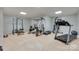 Well-equipped home gym with multiple machines and free weights provides workout space at 1342 Crown Ridge Dr # 38, Fort Mill, SC 29708