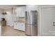 The kitchen features stainless appliances, white cabinets, granite countertops, and hardwood flooring at 1342 Crown Ridge Dr # 38, Fort Mill, SC 29708
