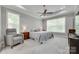 The bedroom features trey ceiling, ceiling fan, large windows, and neutral colors at 1342 Crown Ridge Dr # 38, Fort Mill, SC 29708