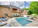 Spacious backyard with a sparkling pool, surrounded by lounge chairs and lush greenery at 1342 Crown Ridge Dr # 38, Fort Mill, SC 29708