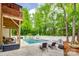 Refreshing backyard pool area with lounge chairs and a patio, perfect for relaxing outdoors at 1342 Crown Ridge Dr # 38, Fort Mill, SC 29708
