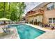 Large backyard pool with ample seating and lounge chairs, ideal for summer relaxation at 1342 Crown Ridge Dr # 38, Fort Mill, SC 29708