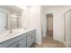 Contemporary bathroom featuring a double sink vanity and a separate shower and walk-in closet at 138 Maritime St, Mooresville, NC 28117
