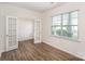 Bright office space featuring French doors, hardwood floors and a large window at 138 Maritime St, Mooresville, NC 28117