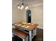 Dining area with wood floors and an ornate modern light fixture at 1400 Lackey St, Shelby, NC 28152