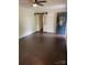 Spacious living room featuring wood flooring, a sliding barn door, and a blue front door with decorative wreath at 1400 Lackey St, Shelby, NC 28152
