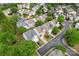 The aerial view shows an established neighborhood with tree-lined streets and well-maintained homes at 15009 Medlock Ln, Charlotte, NC 28277