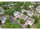 The aerial showcases a neighborhood with tree-lined streets, sidewalks, and well-maintained lawns at 15009 Medlock Ln, Charlotte, NC 28277