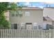 View of home's backyard and siding with a full view of the wooden fence at 15009 Medlock Ln, Charlotte, NC 28277