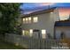 The backyard features a privacy fence, lush lawn, and a well-maintained exterior at 15009 Medlock Ln, Charlotte, NC 28277
