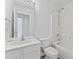 Bathroom with shower-tub combo, vanity sink, mirror, and toilet at 15009 Medlock Ln, Charlotte, NC 28277