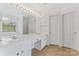 Bright bathroom featuring double sinks, vanity, and a large mirror with great lighting at 15009 Medlock Ln, Charlotte, NC 28277