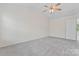 A spacious bedroom with vaulted ceilings and a ceiling fan at 15009 Medlock Ln, Charlotte, NC 28277