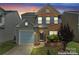 Beautiful home with brick and vinyl siding, attached garage, and inviting entrance at 15009 Medlock Ln, Charlotte, NC 28277