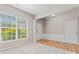 Bright foyer with wood floors, decorative molding, and a charming front door with stained glass at 15009 Medlock Ln, Charlotte, NC 28277