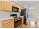 Kitchen featuring stainless steel appliances and light wood cabinets at 15009 Medlock Ln, Charlotte, NC 28277