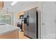 Bright kitchen with stainless steel appliances and light wood cabinets at 15009 Medlock Ln, Charlotte, NC 28277