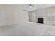 Living room with neutral carpet, fireplace and staircase at 15009 Medlock Ln, Charlotte, NC 28277