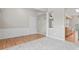 Spacious living area featuring carpet and hardwood floors, with open access to other rooms at 15009 Medlock Ln, Charlotte, NC 28277
