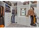Walk-in closet featuring clothing racks, shelves, and a built-in dresser with a mirror at 1550 High St, Charlotte, NC 28211