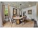 Elegant dining room with an oval table, stylish chairs, unique lighting, and sophisticated decor at 1550 High St, Charlotte, NC 28211