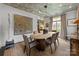 Well-appointed dining area featuring modern lighting, stylish artwork, and comfortable seating for an elegant dining experience at 1550 High St, Charlotte, NC 28211