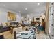 Open concept living room with sleek decor and access to other living spaces within the home at 1550 High St, Charlotte, NC 28211