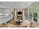 Bright and open living space featuring neutral tones, large windows and seamless indoor-outdoor flow at 1550 High St, Charlotte, NC 28211
