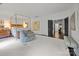 Spacious main bedroom with gold canopy bed, sitting area, and view of the hallway and ensuite bathroom at 1550 High St, Charlotte, NC 28211