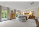 Spacious main bedroom with four-poster bed, neutral colors, and bright natural light at 1550 High St, Charlotte, NC 28211