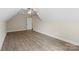Bright bedroom boasts wood floors, neutral walls, and a fan with light at 156 Clear Springs Rd, Mooresville, NC 28115