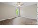Bright bedroom with hardwood floors, ceiling fan, natural light and large window at 156 Clear Springs Rd, Mooresville, NC 28115