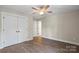 Bright bedroom with hardwood floors, ceiling fan, large closet and adjoining bathroom at 156 Clear Springs Rd, Mooresville, NC 28115