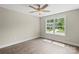 Bright bedroom with hardwood floors, ceiling fan, natural light and large window at 156 Clear Springs Rd, Mooresville, NC 28115
