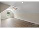 A spacious bedroom with hardwood floors, a ceiling fan, and a window for natural light at 156 Clear Springs Rd, Mooresville, NC 28115