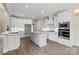 New kitchen with stainless appliances, white cabinetry, stone countertops and center island at 156 Clear Springs Rd, Mooresville, NC 28115
